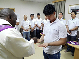 Fr Bongani, AoS port chaplain in Richards Bay South Africa distributes ash