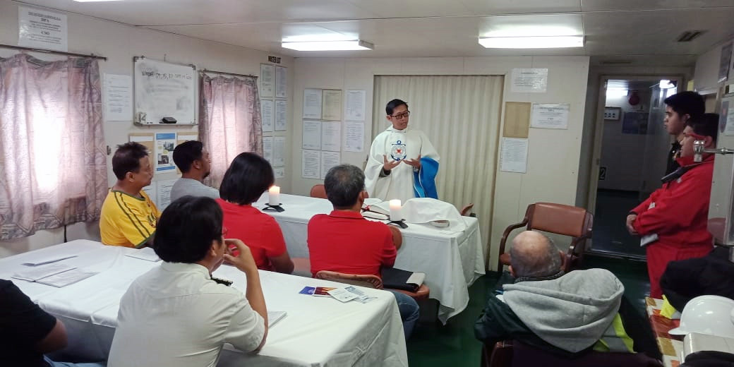 Fr Rico celebrates Mass on board