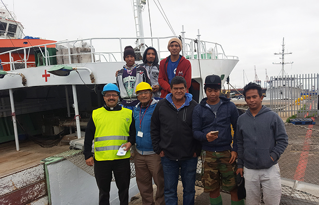 Fr Gerardo AoS Cape Town with crew of a ship