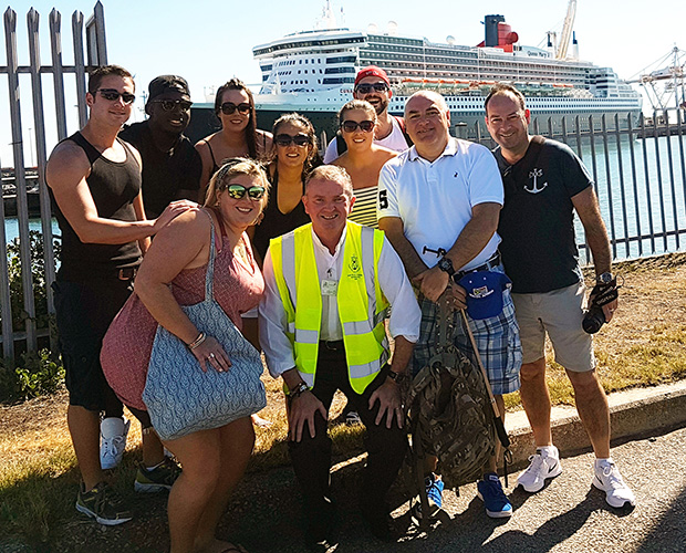 Fr Jerry Browne (in high-viz vest) with Fr David and the Queen Mary 2 crew